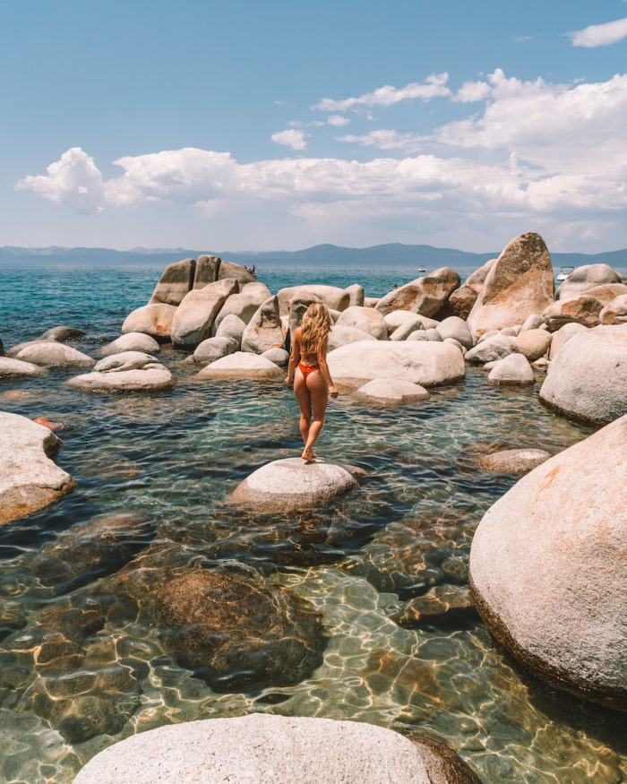 Michelle Halpern standing on a rock at Creek Beach