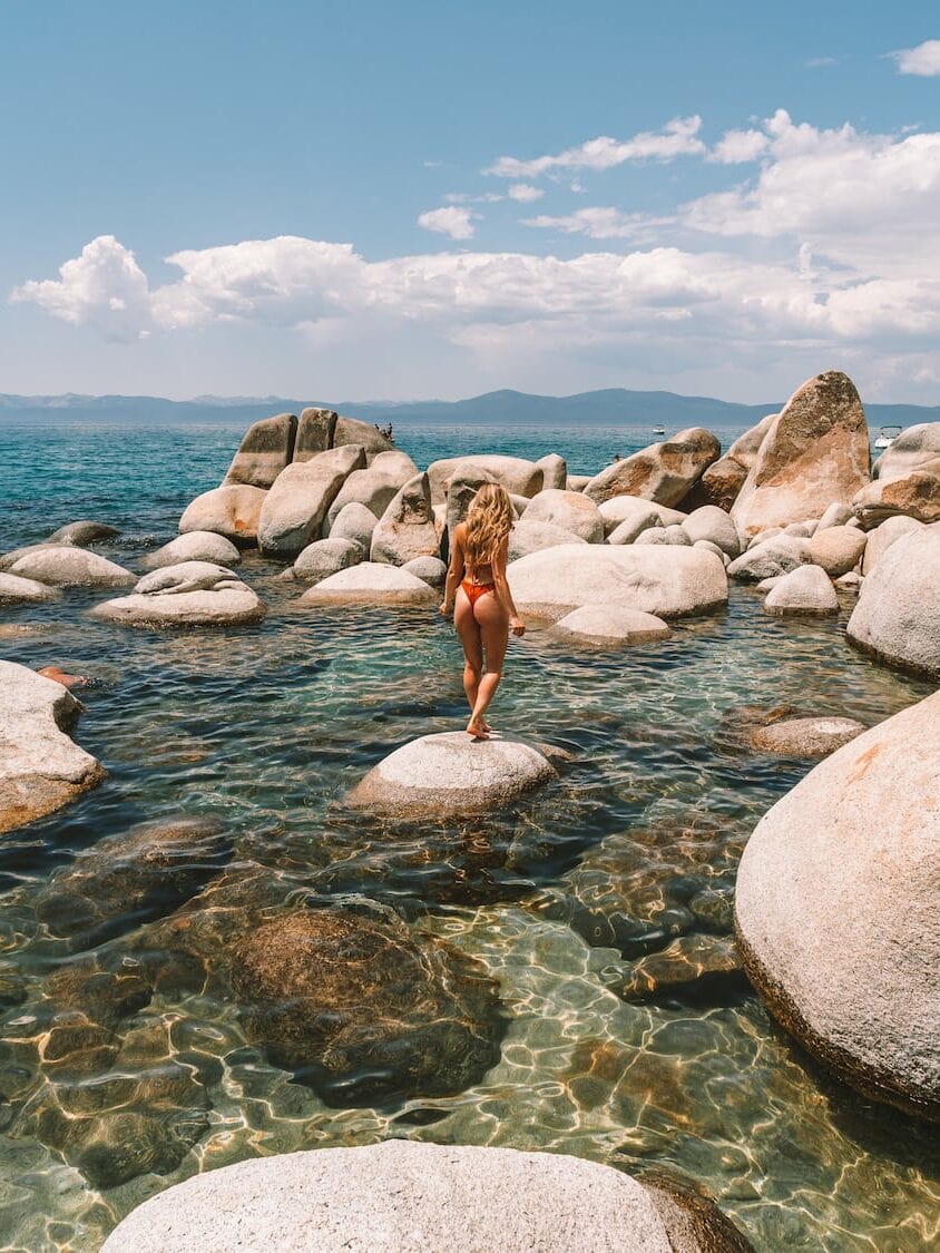 Michelle Halpern standing on a boulder at Creek Beach