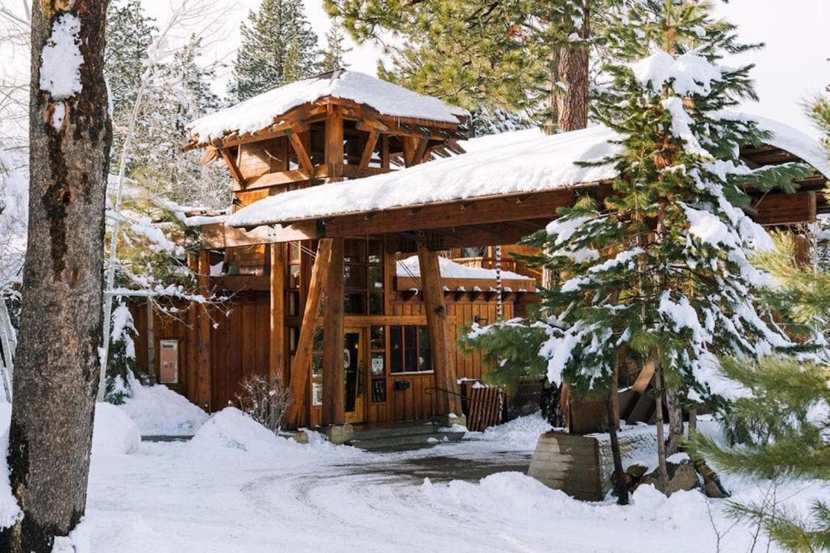 A snow covered entrance at Gravity Haus hotel in Lake Tahoe