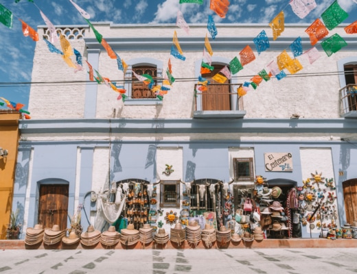 Colorful streets of Todos Santos with hats and goods lined up outside