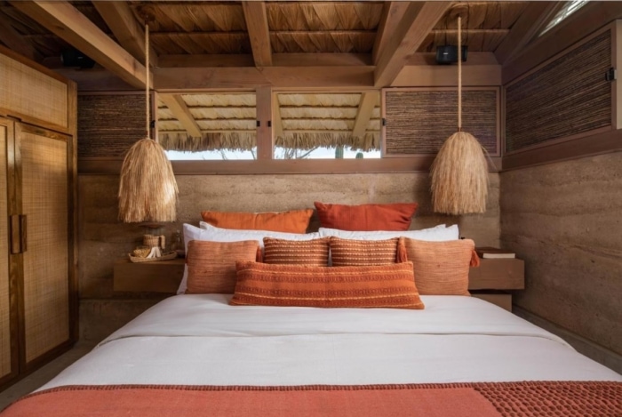 El Perdido Desert Dream guest room interior with red bedding