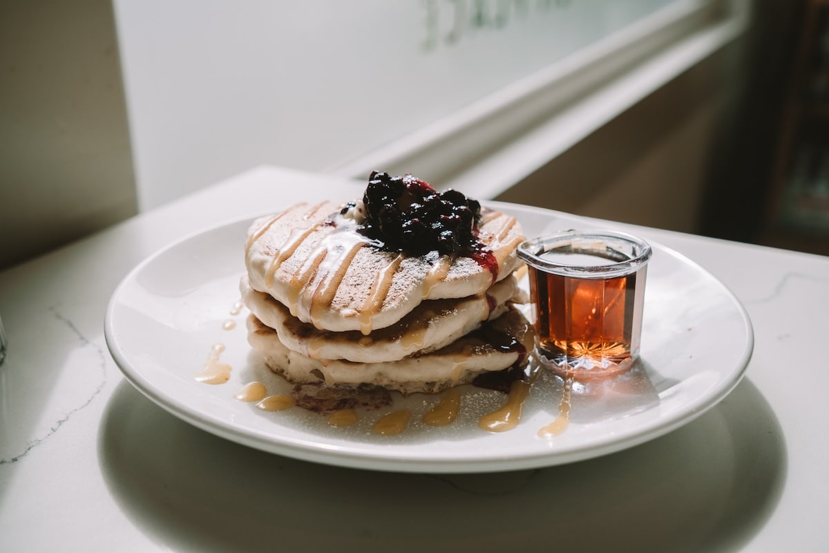 Lemon ricotta pancakes with blueberry compote on top from Winston's
