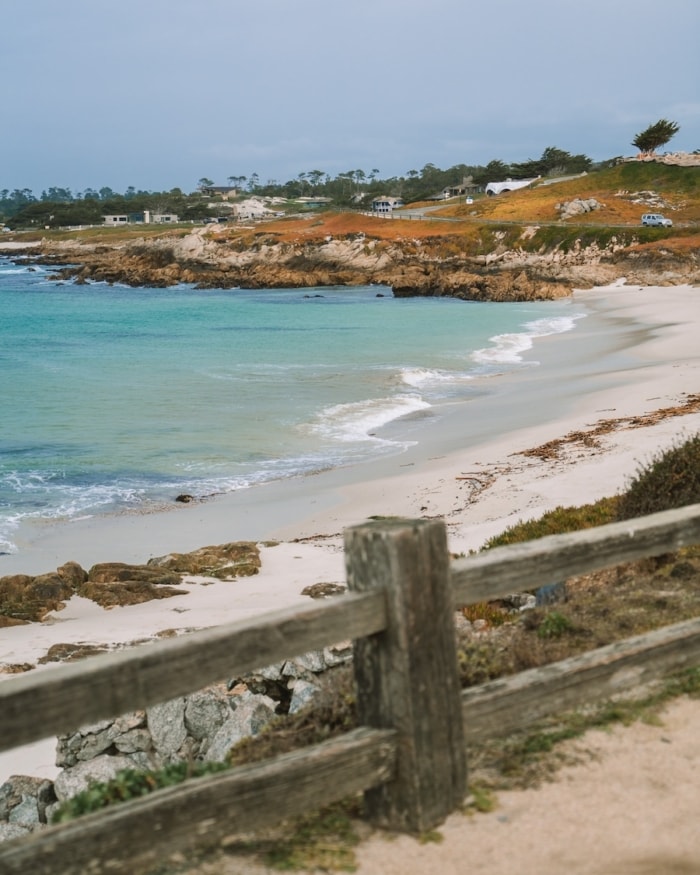 White sand beach and turquoise water along 17 Mile Drive in Monterey and Carmel area 