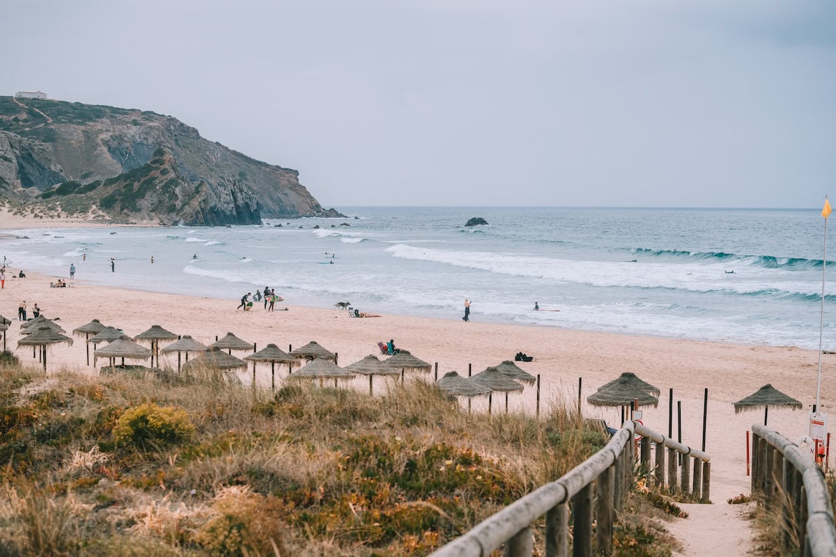 Thatched beach umbrellas at Praia do Amado, Western Algarve