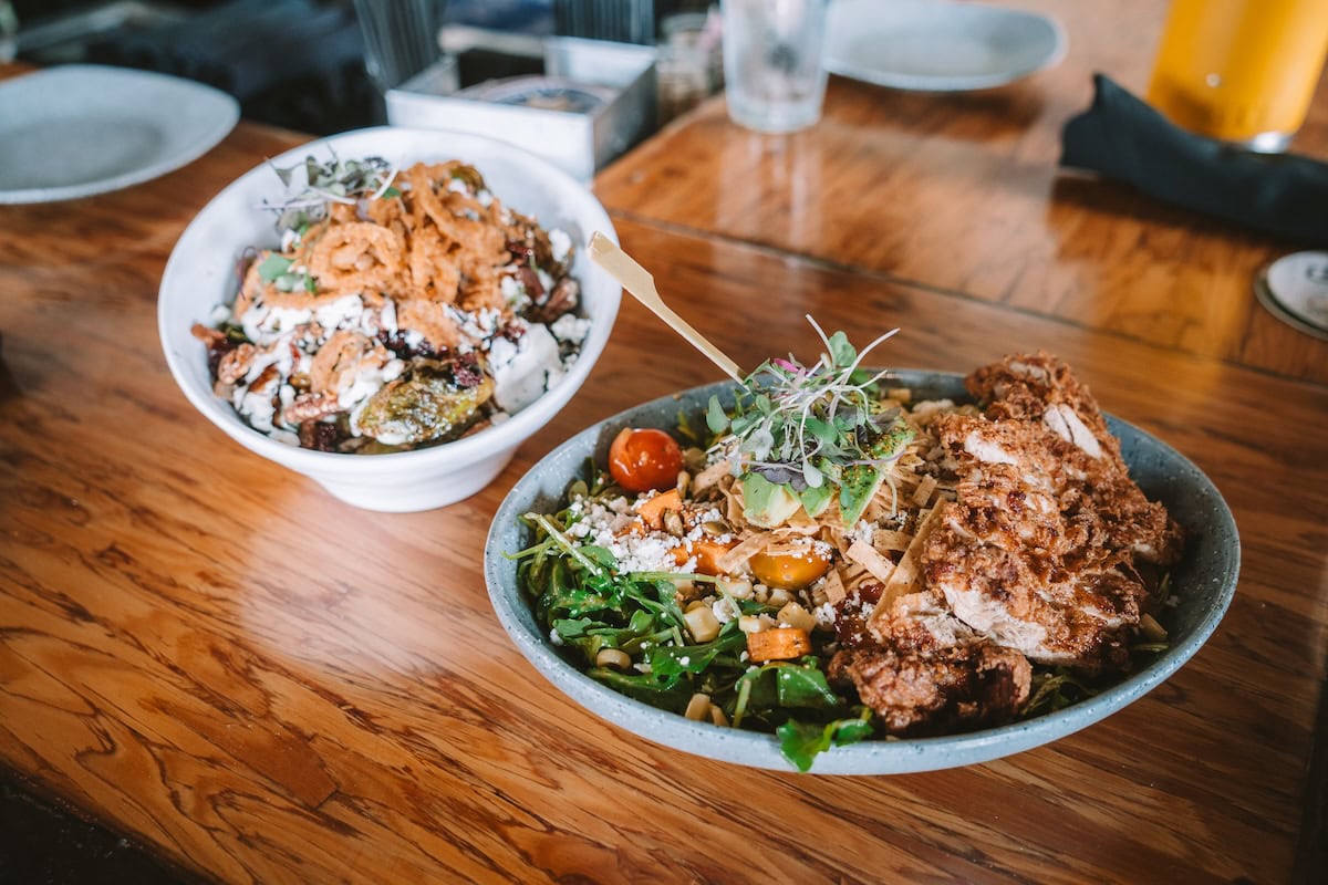 Street corn salad and brussels sprouts dish at Local Tap House, considered one of the best restaurants in Oceanside ca by locals
