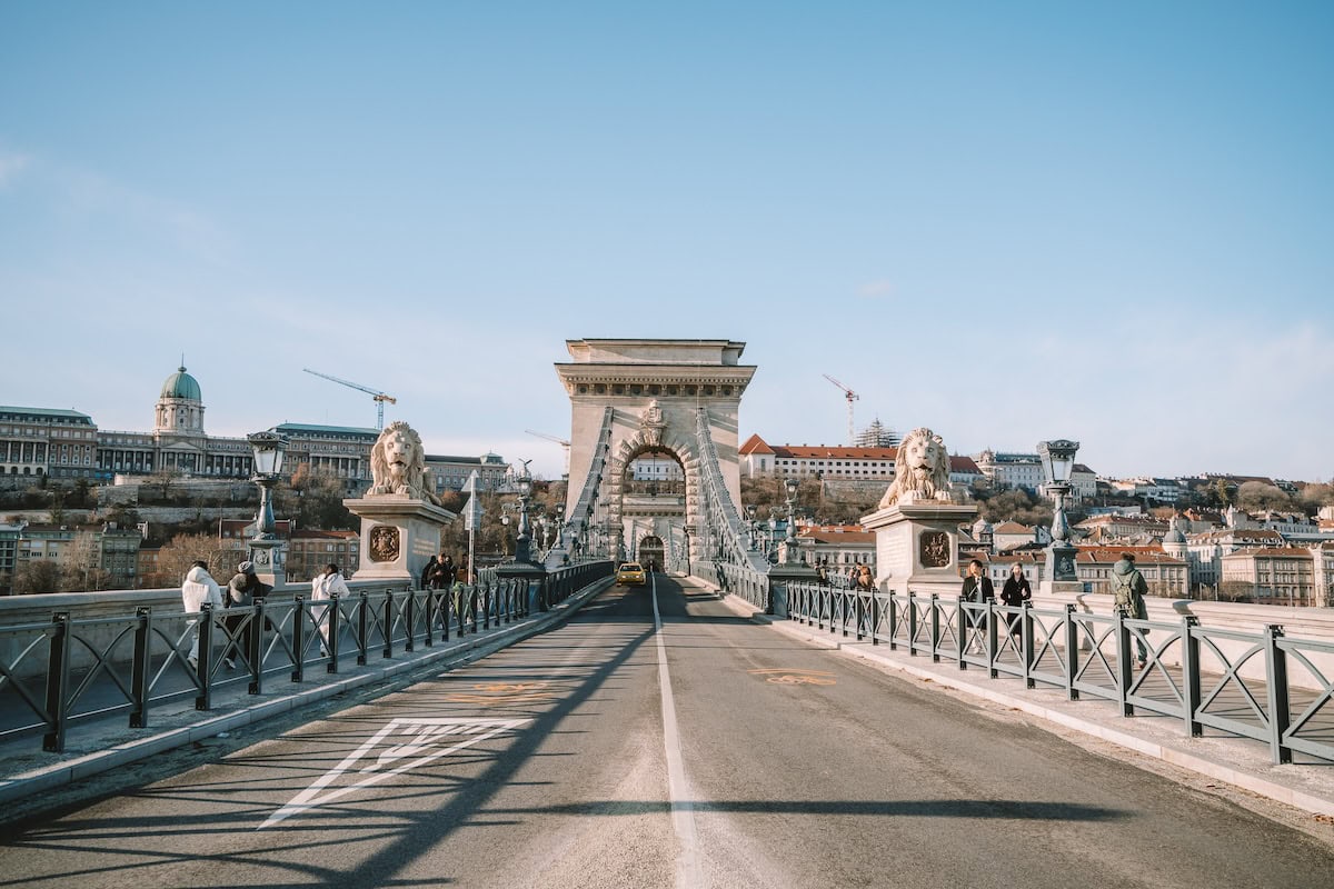Széchenyi Chain Bridge Wide shot of Széchenyi Chain Bridge in Budapest taken from the middle of the street