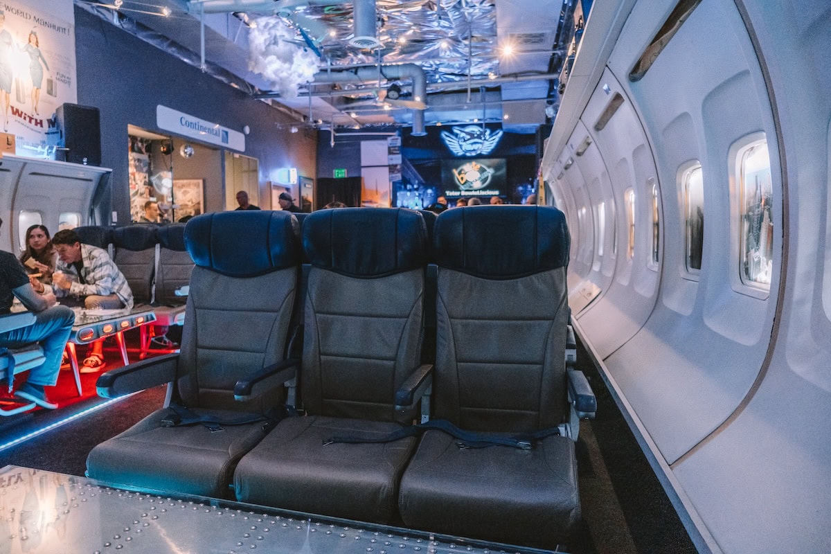 Plane seats inside the PS Air Bar - one of the most unique things to do in Palm Springs