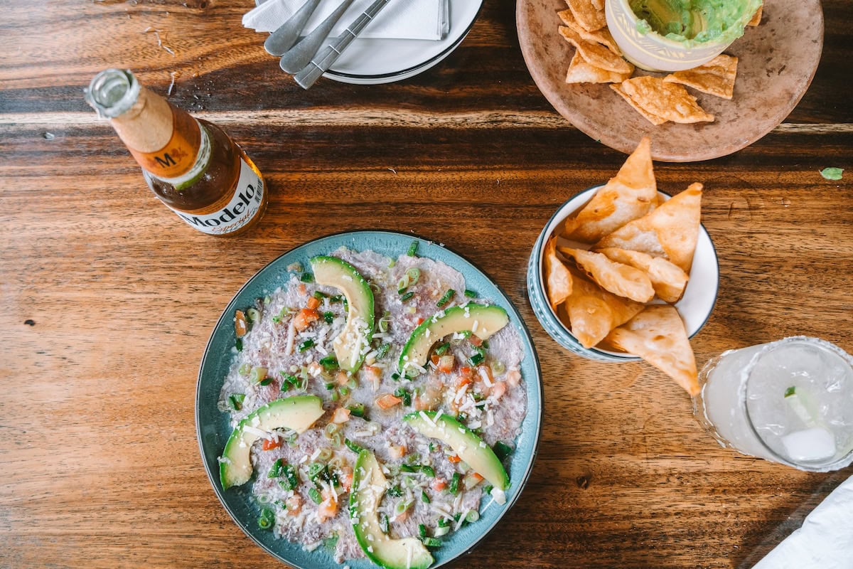 Tuna carpaccio, beer and chips at Howler's Beach Lounge