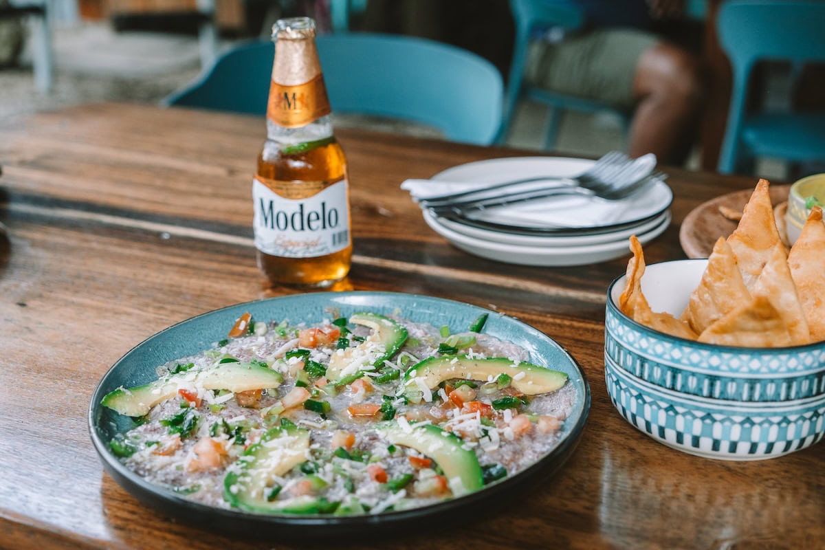 Tuna carpaccio, beer and chips at Howler's Beach Lounge, one of the best restaurants in Nosara, Costa Rica