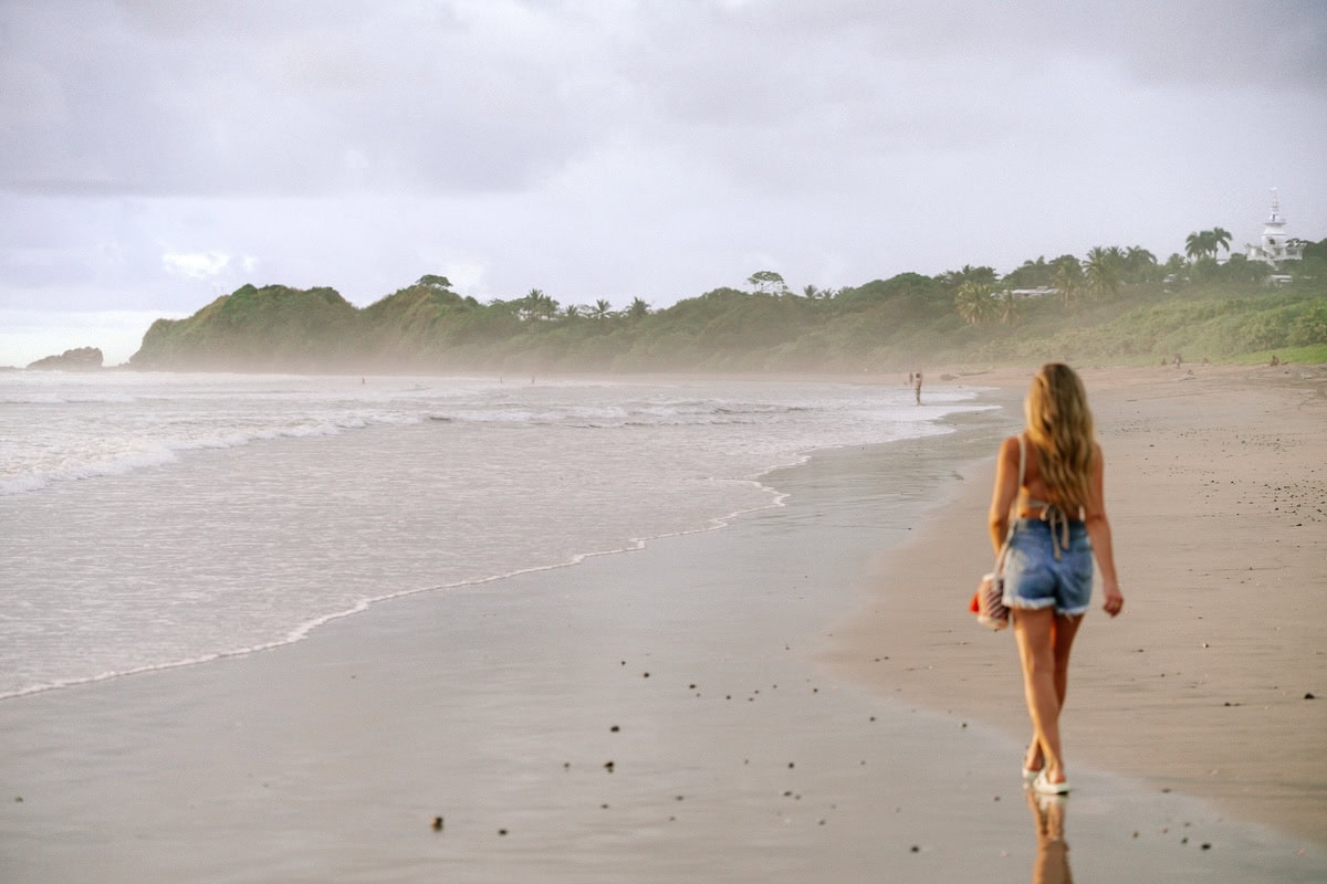 Michelle Halpern walking on the beach at Playa Guiones 