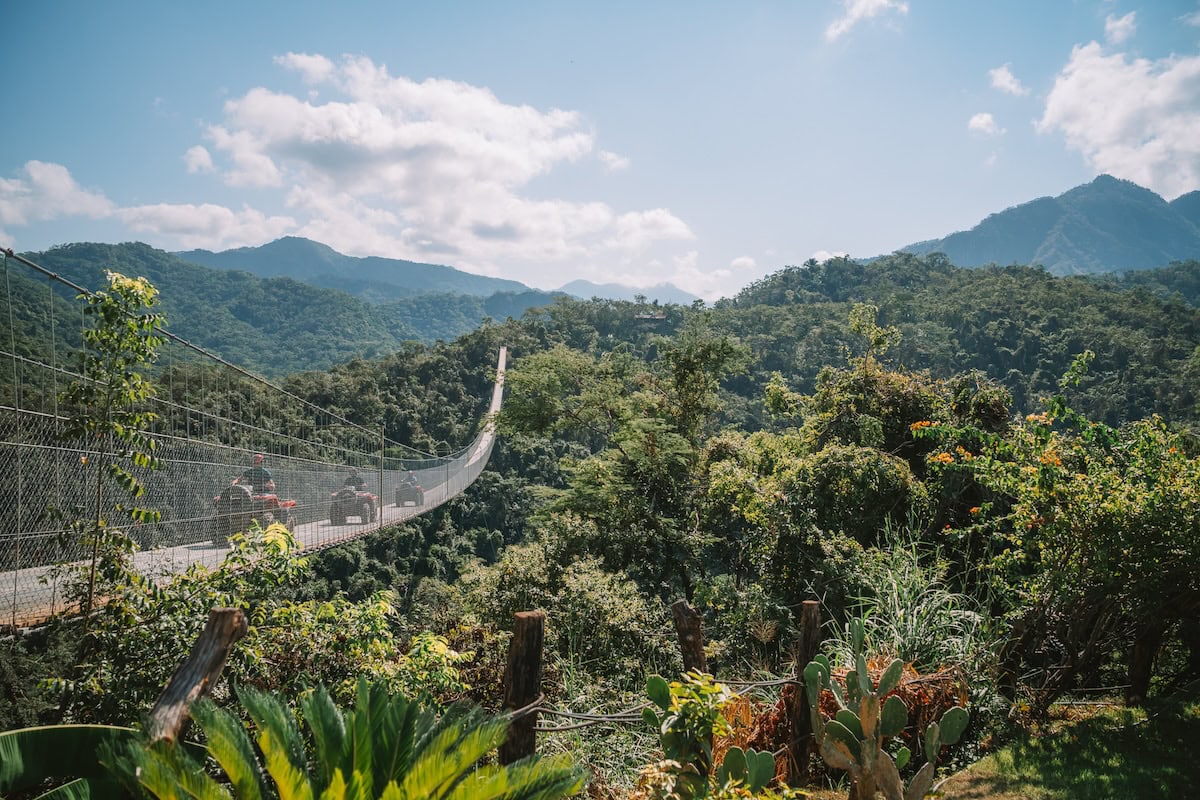 ATVs go over a suspension bridge in Puerto Vallarta