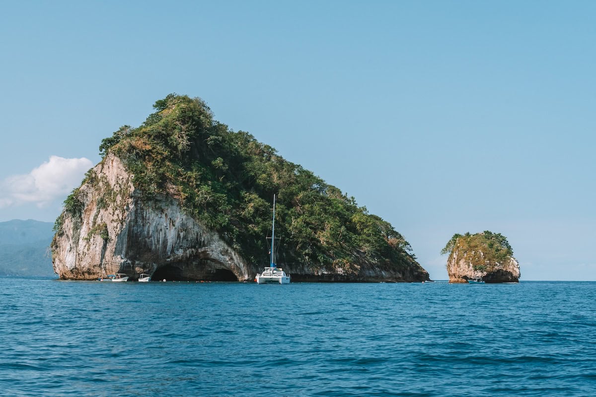 Sailboat hovering around Los Arcos de Mismaloya Islands islands in the Bay of Banderas, one of the best things to do in Puerto Vallarta