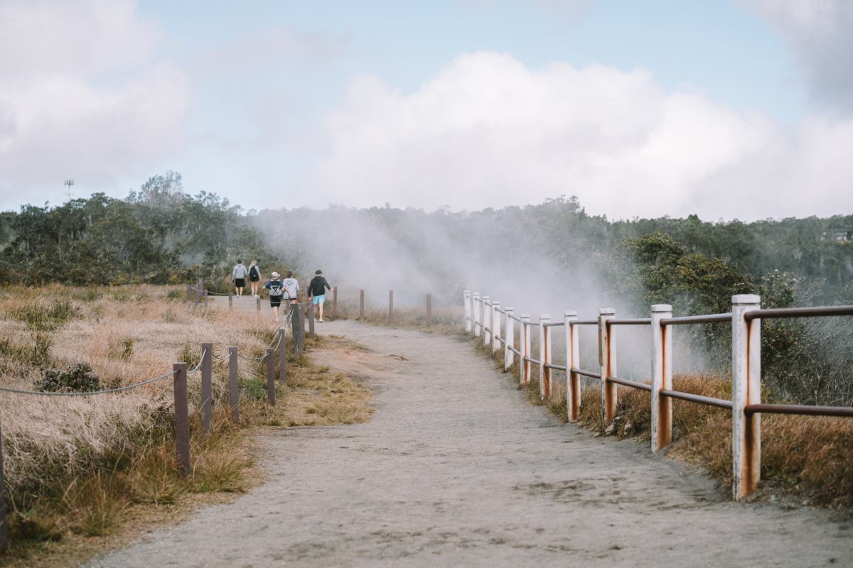 Volcanoes National Park Steam coming out from the ground at Volcanoes National Park near a path in Big Island, Hawaii