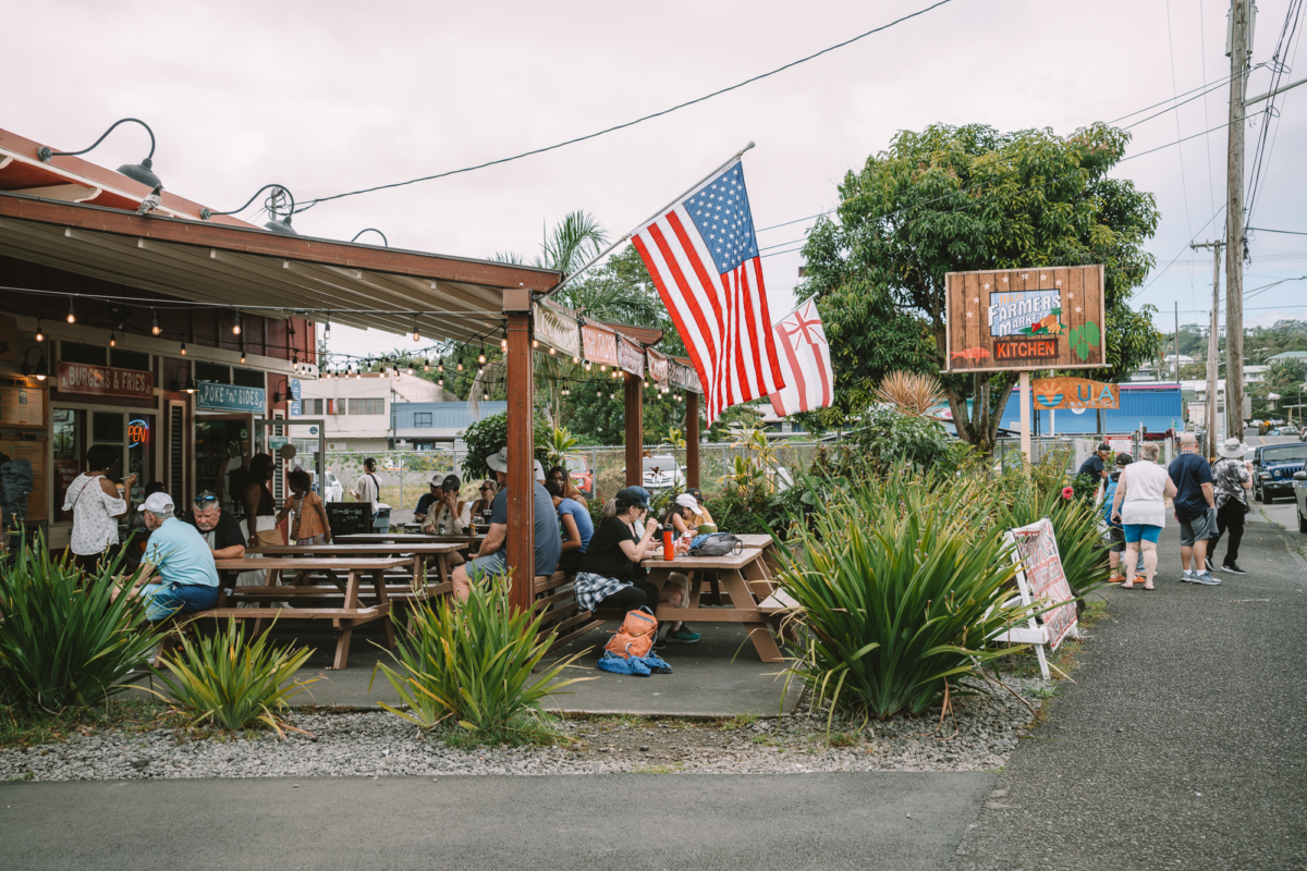 Hilo Farmer's Market Kitchen Image of the Hilo Farmer's Market Kitchen with diners eating outside on patio tables.