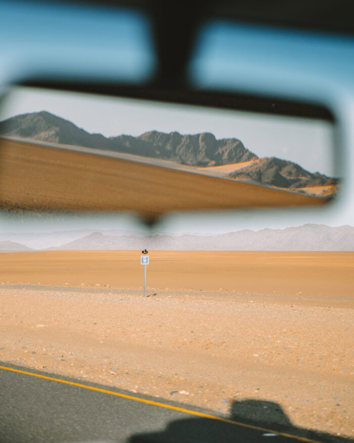 View of Sossusvlei View of Sossusvlei in car's rearview mirror.