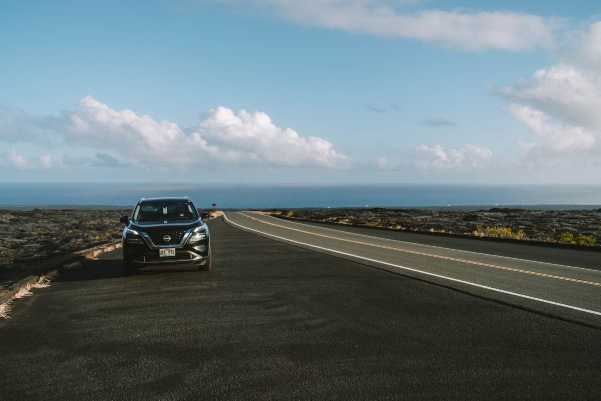 car parked Big Island Car parked in a road on Big Island, Hawaii. Featuring the ocean and blue skies in the background with lava fields to each side.