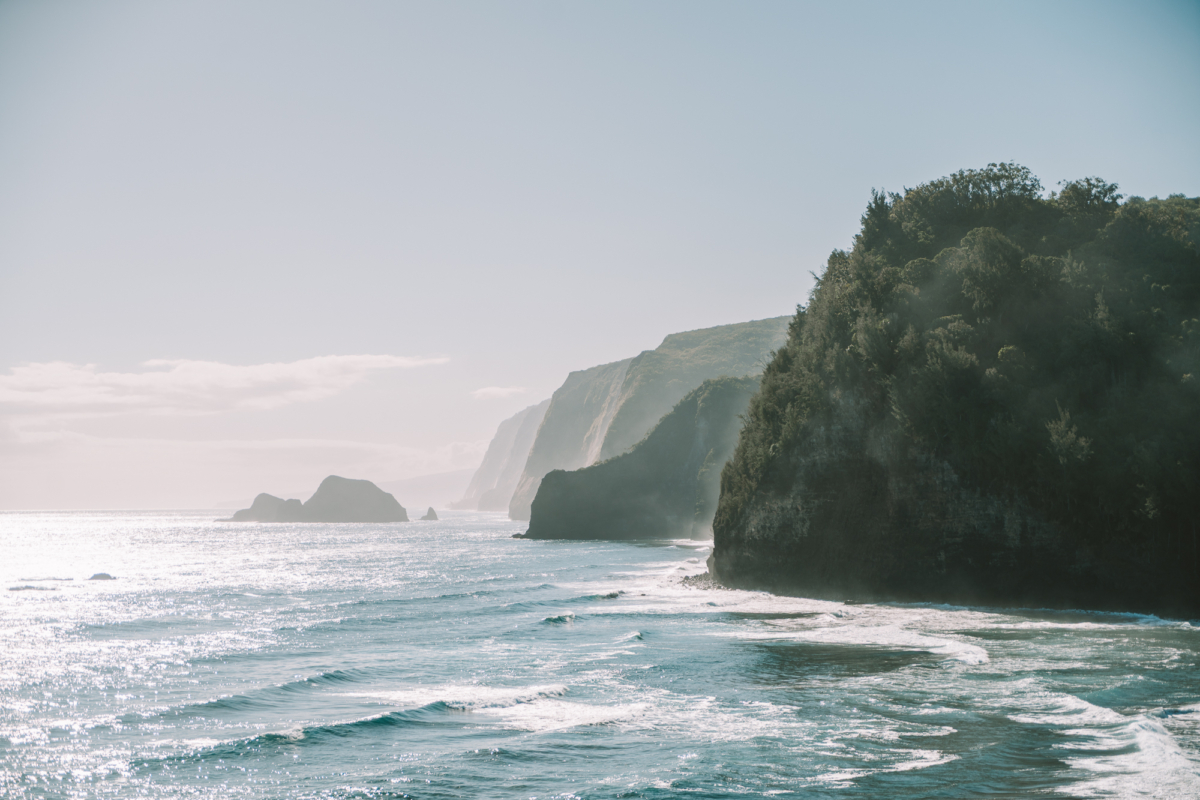 ocean with cliffs Overview image of the ocean with cliffs in a distance that dissipate in view as the ocean mist engulfs them.