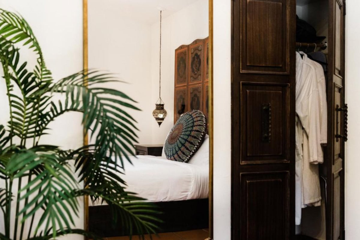Talavera Palm Springs Image of a bedroom at Talavera Palm Springs through the mirror.