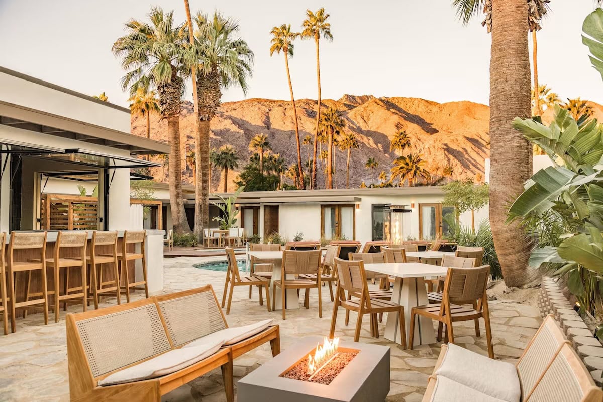 Fire pit outside bar Fire pit scene out by the bar and pool area with sunset on the mountains in the background.