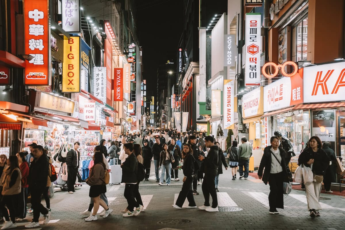 Bustling street in Myeondong Seoul Bustling street in Myeondong Seoul at night with tons of bright signs, lights and pedestrians