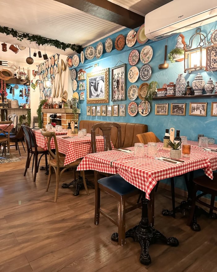 Alfredo restaurant Interior of Italian restaurant with red checkered tablecloth and blue painted walls