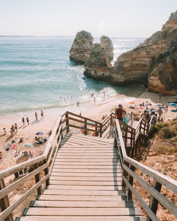 Praia do Camilo Wooden staircase leading down to Praia do Camilo in Algarve