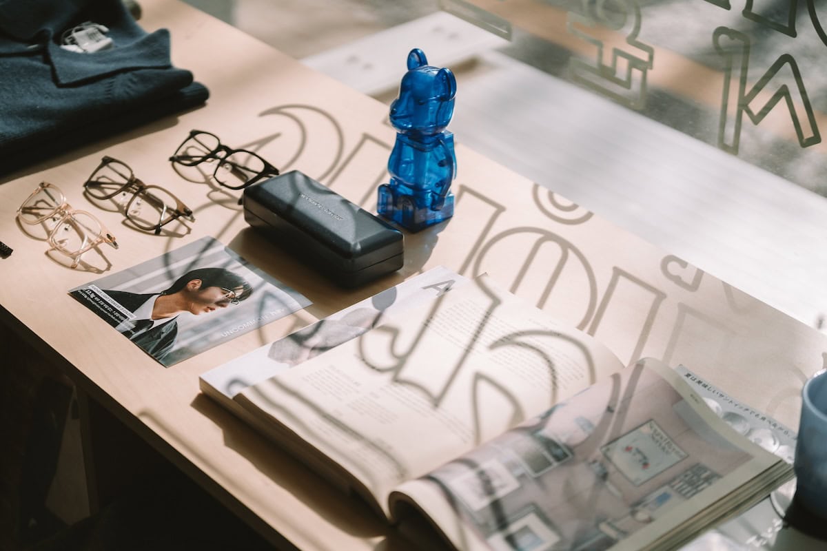 Stereophonic Sound Display in window selling random fashion items with the shadow from the letters in the window casting over it.