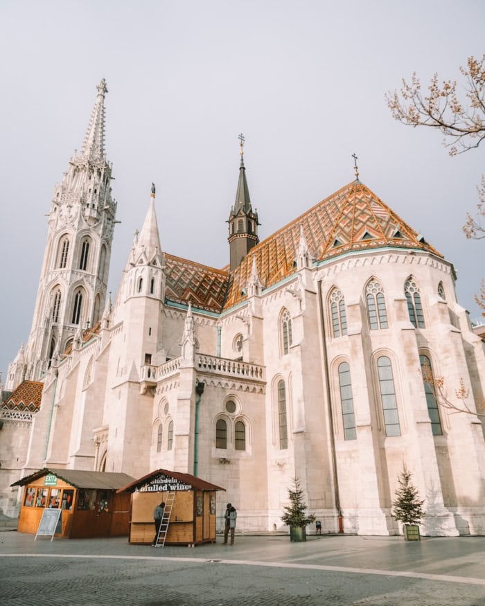 Matthias Church Matthias Church in Budapest standing tall with some Christmas markets in the foreground