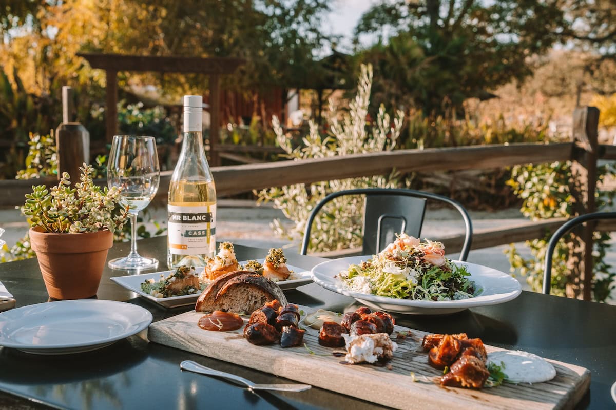 Table at Cass Winery Table at Cass Winery with a meat and cheese platter, salad and bottle of wine