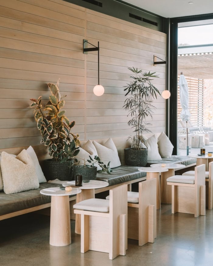 Booker Vineyard in Paso Robles Chic minimalist interior with tables and bench seating at Booker Vineyard in Paso Robles