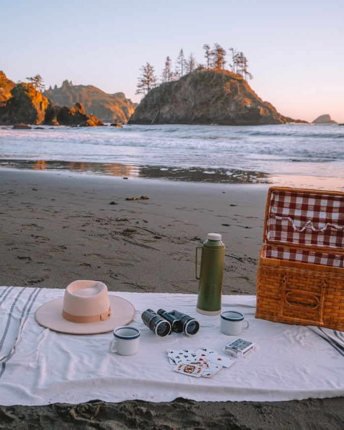 College Cove Picnic setup on a blanket along the sand at College Cove | Best Beaches in California