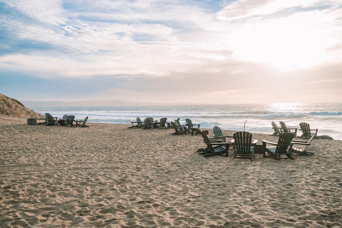 adirondack chairs High up sand dune above the beach with adirondack chairs set up