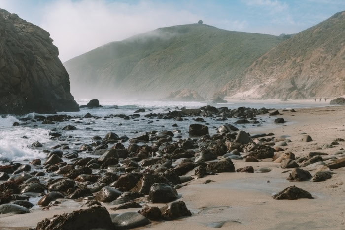 Pfeiffer Beach in Big Sur Large black boulders dotting the beach at Pfeiffer Beach in Big Sur