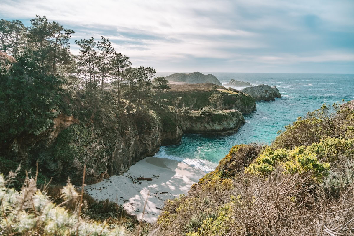 Point Lobos in California Small turquoise cove and white sandy beach at Point Lobos in California