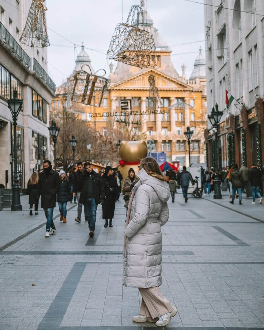 Fashion Street in Budapest Michelle Halpern standing in a puffy white coat on Fashion Street in Budapest