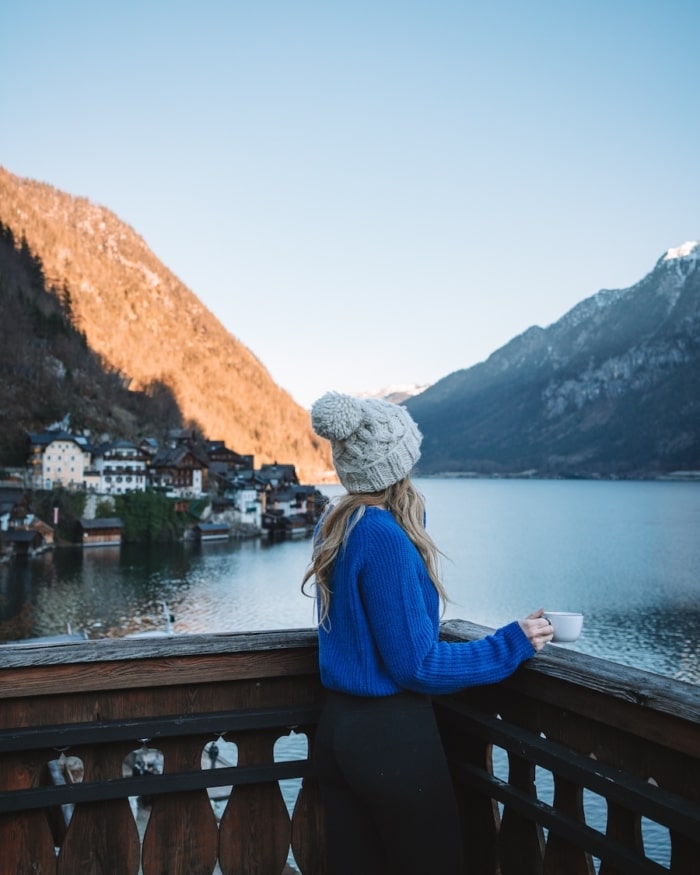 Seehotel Gruner Baum Michelle Halpern wearing a blue sweater on the balcony of her hotel in Hallstatt