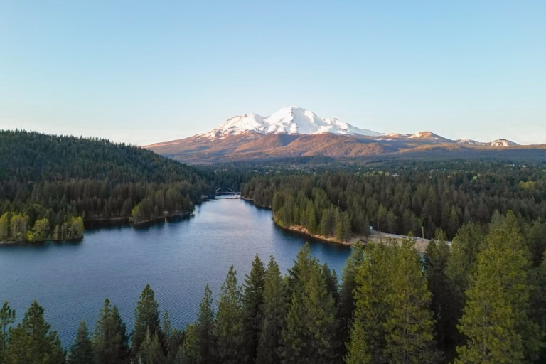 Drone shot of Lake Siskiyou with Mt. Shasta in the background at golden hour.