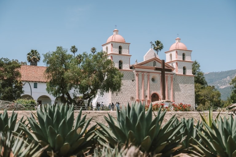 The Mission in Santa Barbara with agave plants in the foreground framing the shot