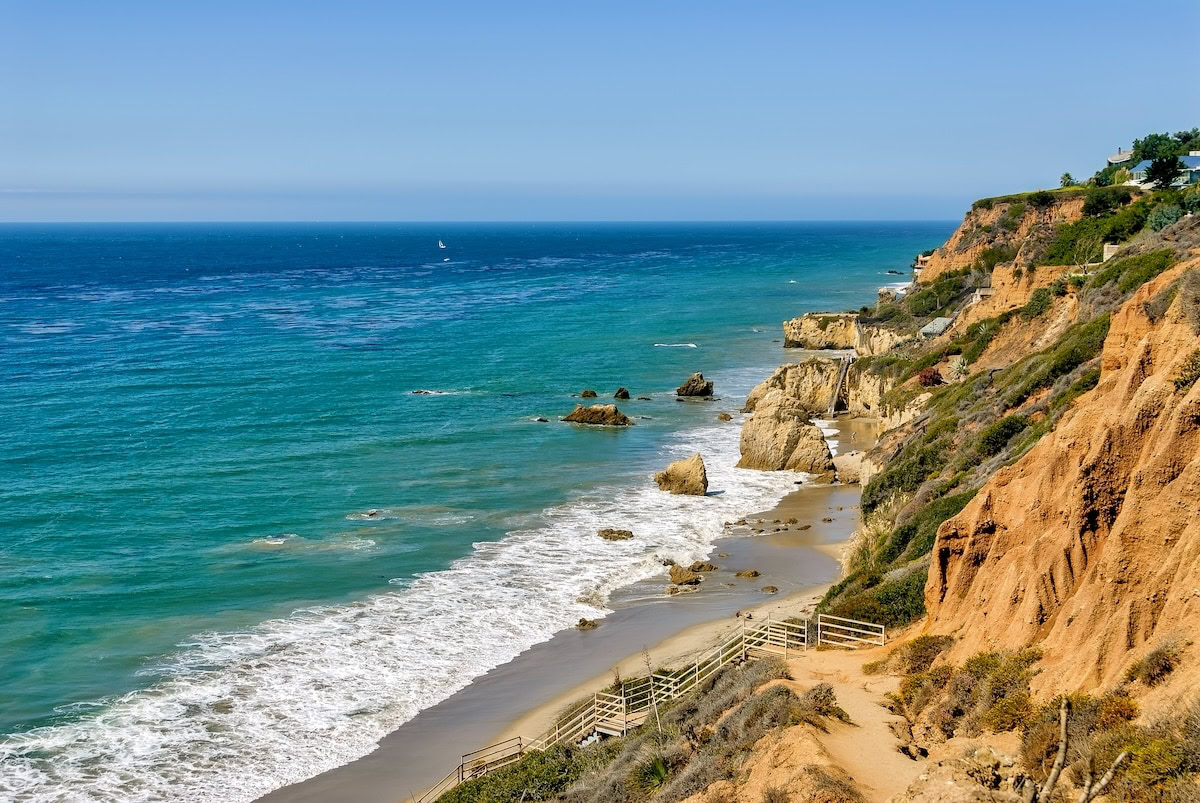 El Matador State Beach Sunny day at El Matador State Beach with sea stacks on the shoreline and a staircase going down to the sand