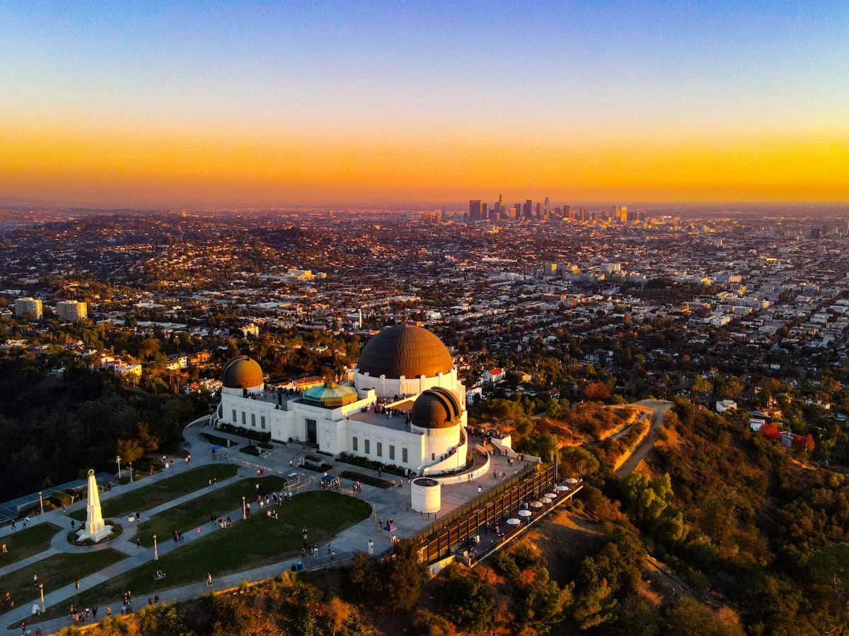 Griffith Observatory Aerial shot of Griffith Observatory at sunset with epic views of Los Angeles beyond