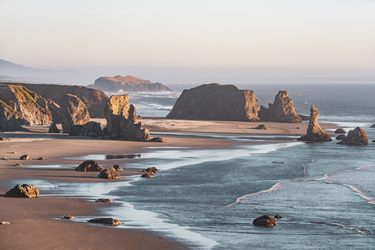 Best Oregon Coast Towns Sea stacks at Bandon Beach, Oregon at golden hour