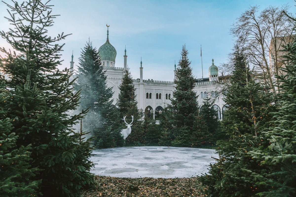 Holiday decorations set up around a small ice skating rink in Tivoli Gardens