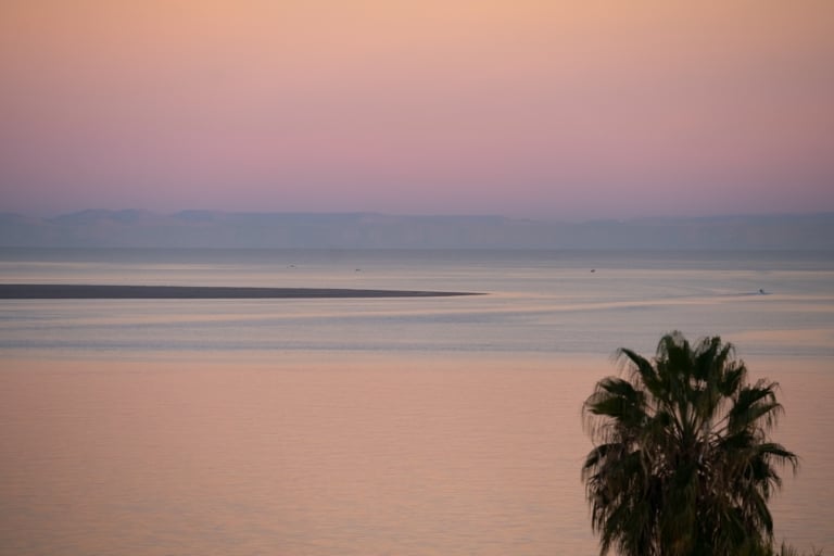 Pink and purple hues along the horizon at sunrise in La Paz