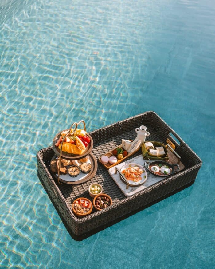 Overhead shot of floating breakfast in a pool