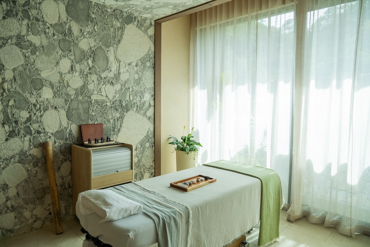 Inside of treatment room with tray of crystals on the bed