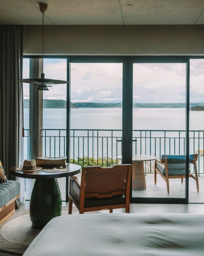 View inside one bedroom king suite at Waldorf Costa Rica with view looking out to the ocean