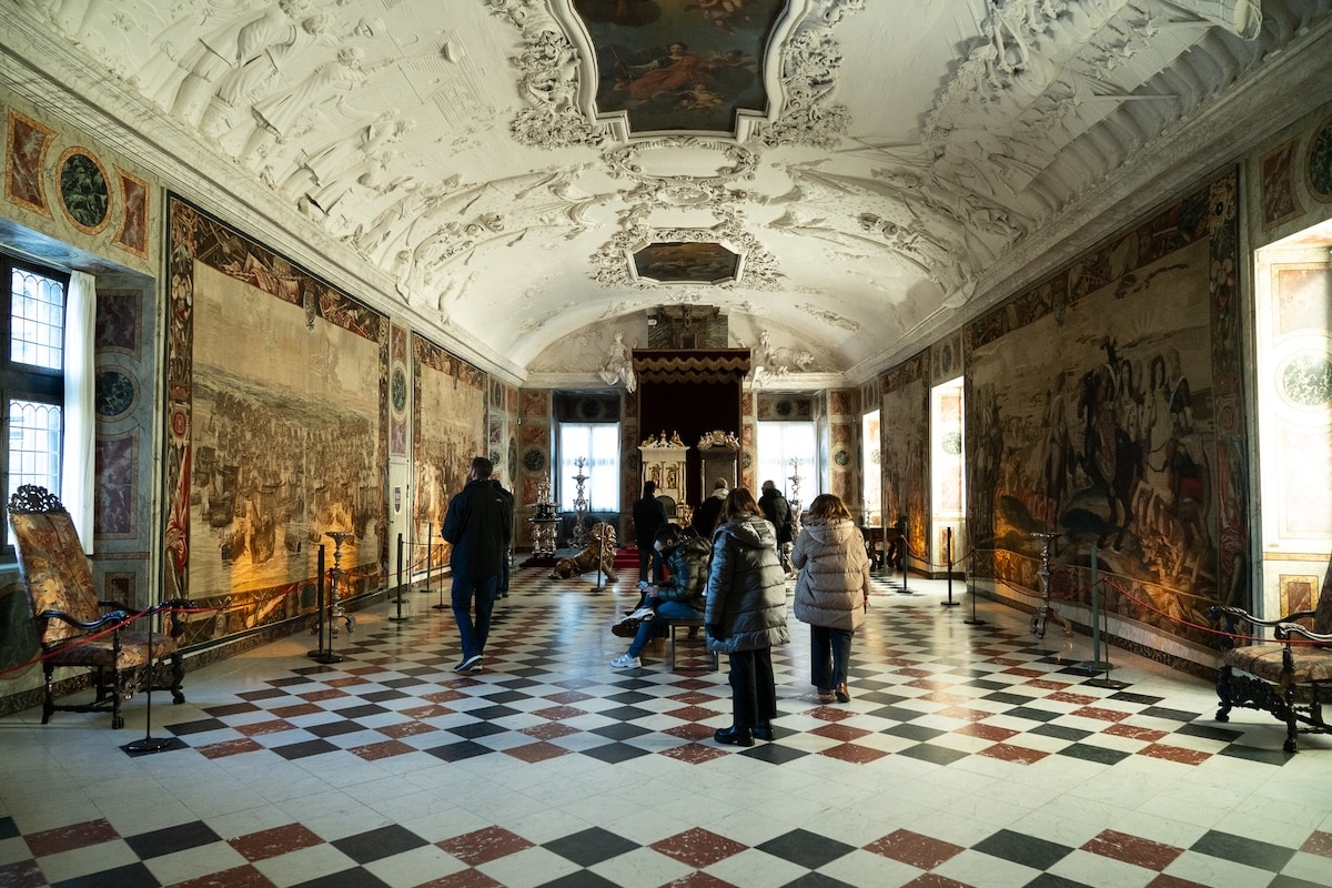 inside Rosenborg Castle Inside a large hall showcasing murals at Rosenborg Castle