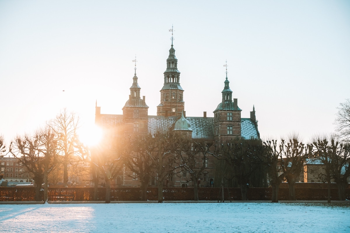 Rosenborg Castle at sunset Rosenborg Castle at sunset with the sun dipping just left the left side of the building