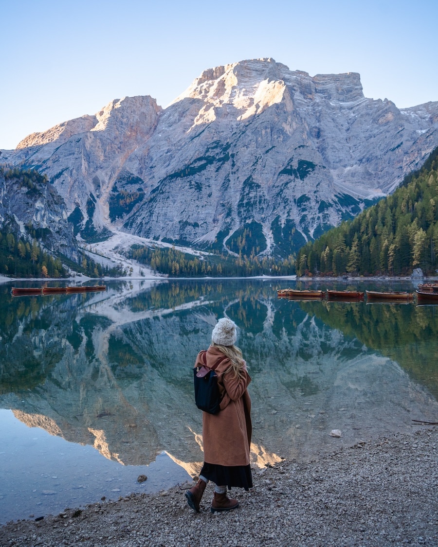 Lago di Braies Michelle Halpern standing on the water's edge at Lago di Braies