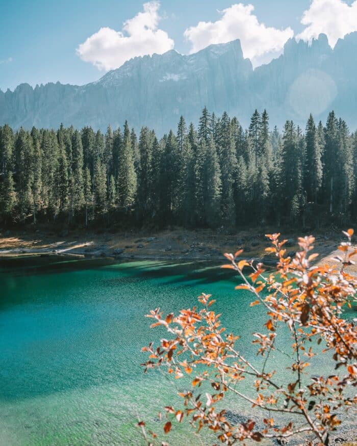 Lago di Carezza water Turquoise water and autumn colored leaves at Lago di Carezza